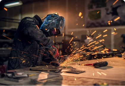  Craftsman Sawing Metal Sparkles Around Workshop